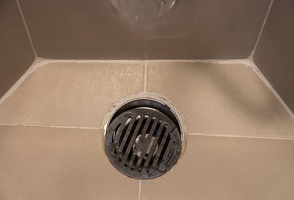 how to unscrew shower drain